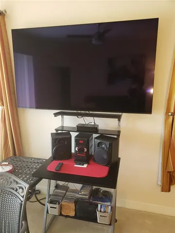 a room with furniture and flat screen tv