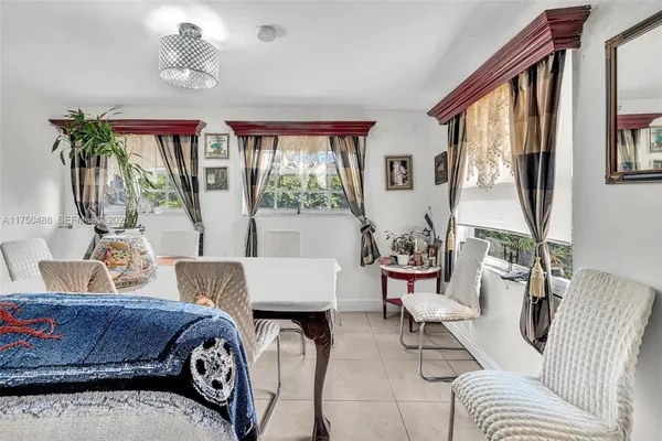 a bedroom with a bed and glass windows