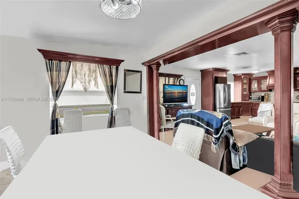 a kitchen with stainless steel appliances granite countertop a stove sink and cabinets