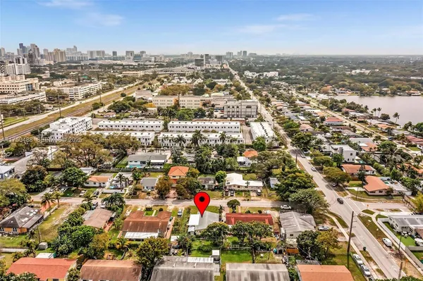 a front view of a house with a yard table and chairs