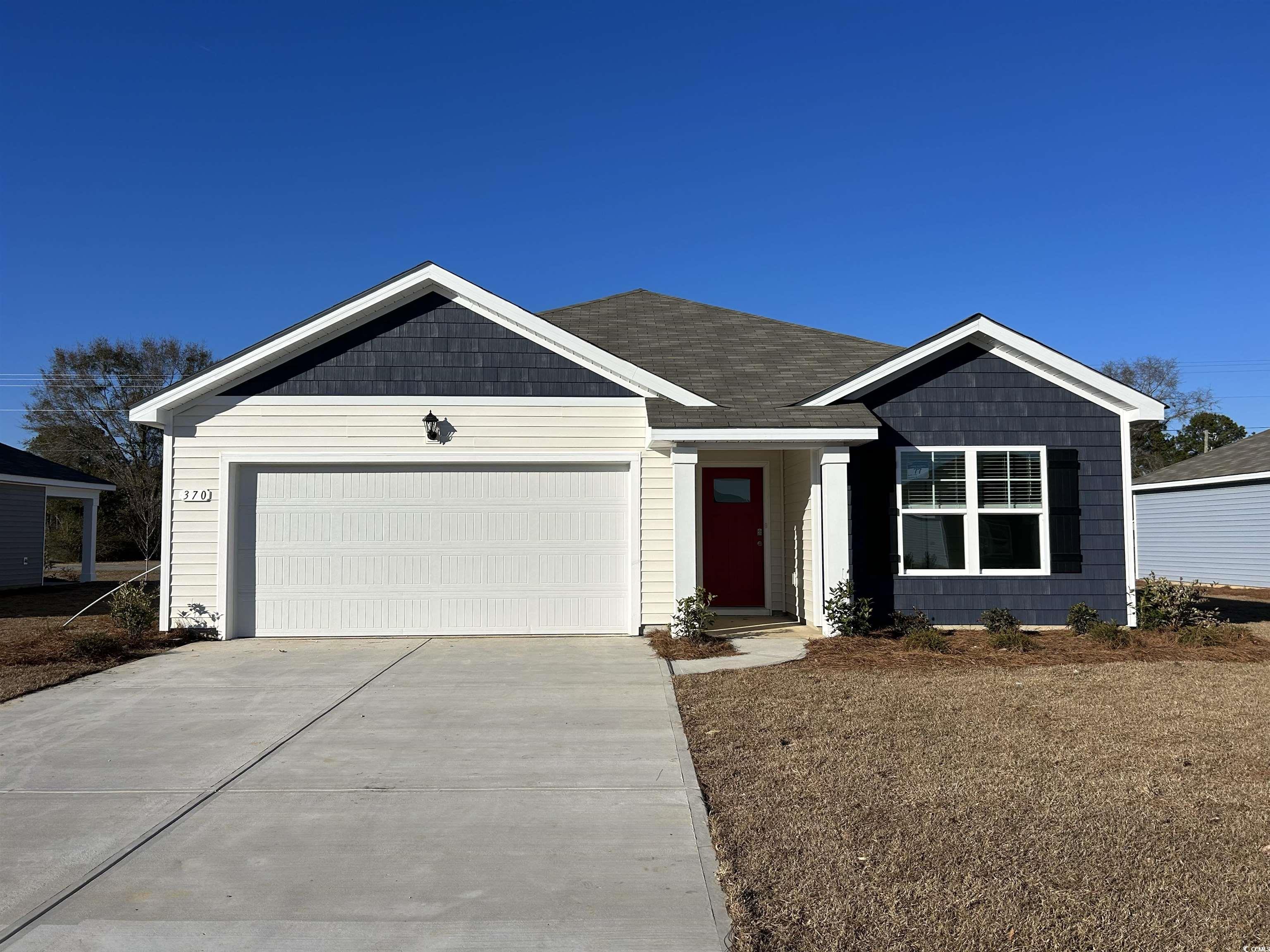 Single story home with a garage and driveway