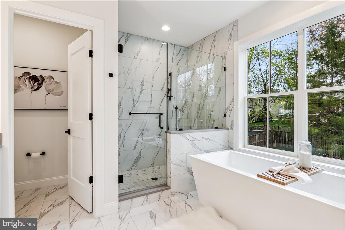 6217 Plainview Road Bethesda, MD 20817 - Photo 13 of 13 a bathroom with a tub shower and sink