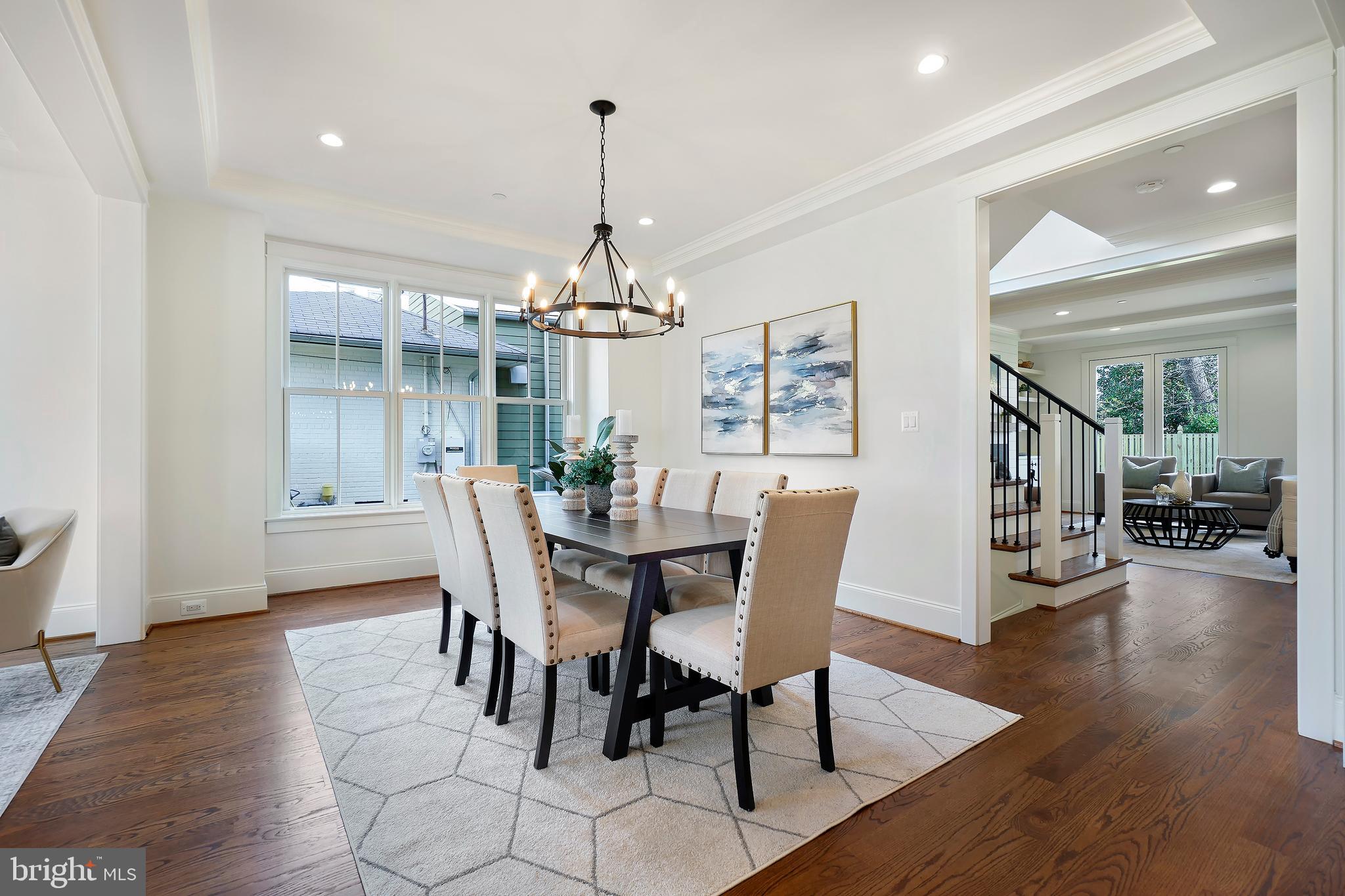 6217 Plainview Road Bethesda, MD 20817 - Photo 7 of 13 a view of a dining room with furniture wooden floor and chandelier