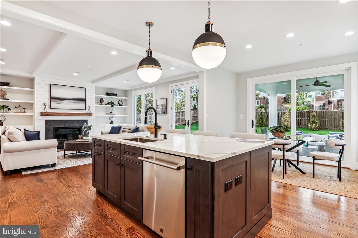 6217 Plainview Road Bethesda, MD 20817 - Photo 8 of 13 a kitchen with a stove and a living room