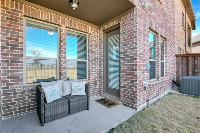 a balcony with furniture and a window