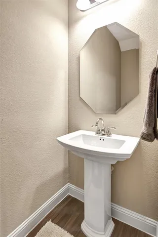 a bathroom with a sink and mirror