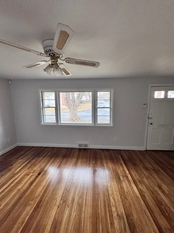 72 Armstrong Circle Braintree, MA 02184 - Photo 4 of 4 a view of an empty room window and wooden floor