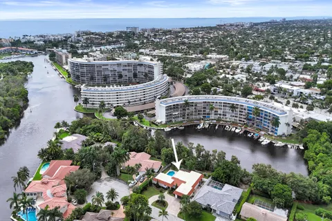 an aerial view of a house with a lake view