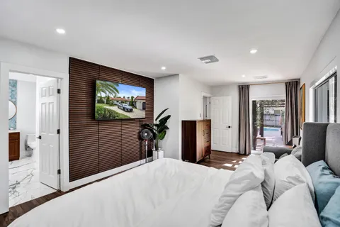 a bedroom with bed and walk in closet