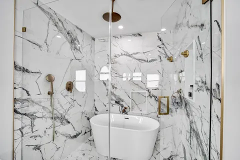 a bathroom with a bathtub sink and toilet