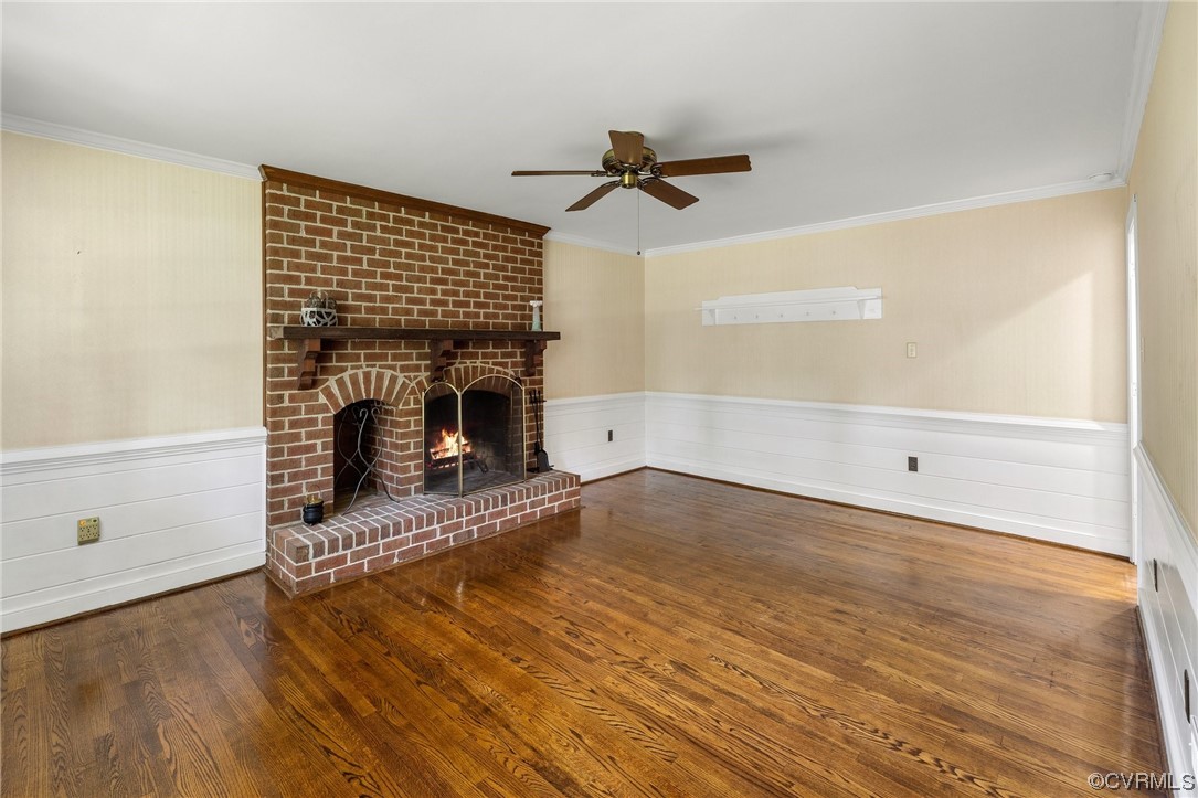 2210 Albion Road Midlothian, VA 23113 - Photo 12 of 36 a living room with wooden floor and a fireplace