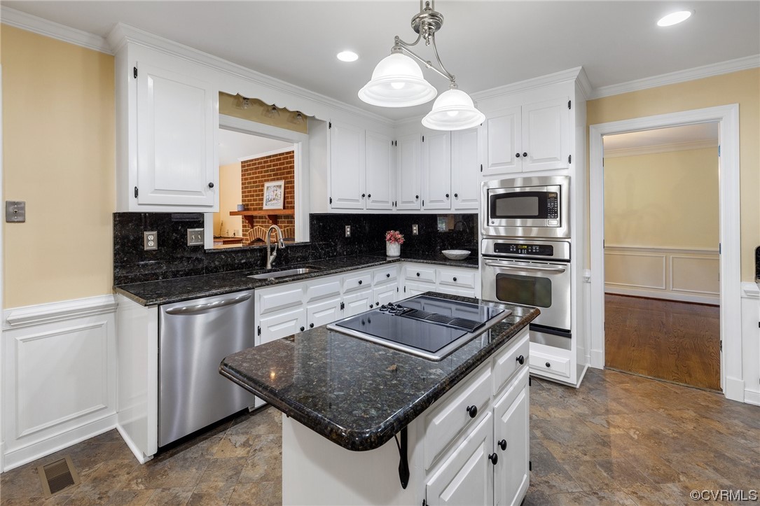 2210 Albion Road Midlothian, VA 23113 - Photo 15 of 36 a kitchen with stainless steel appliances granite countertop a sink stove and refrigerator