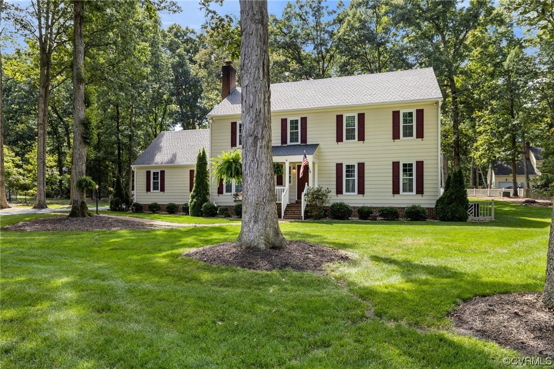 2210 Albion Road Midlothian, VA 23113 - Photo 2 of 36 a front view of a house with a garden and tree