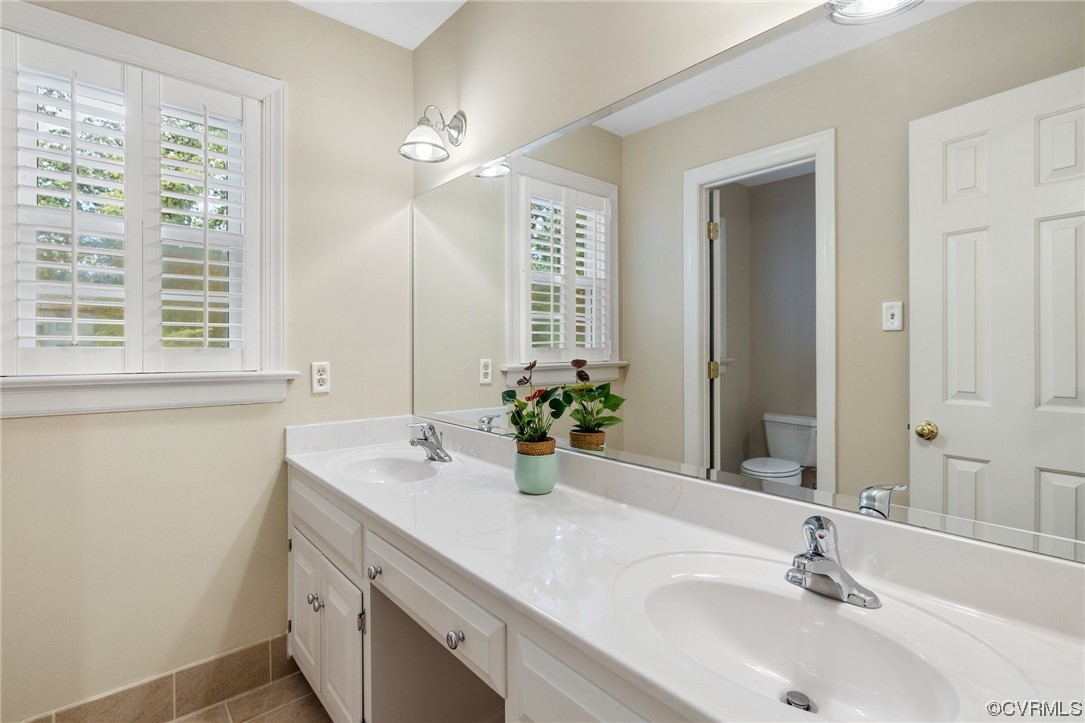 2210 Albion Road Midlothian, VA 23113 - Photo 30 of 36 a bathroom with a sink and a mirror