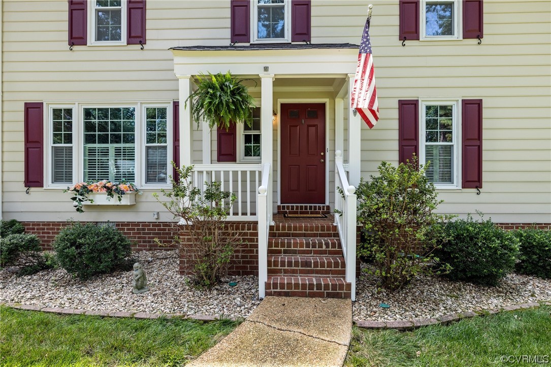 2210 Albion Road Midlothian, VA 23113 - Photo 4 of 36 a front view of a house with a yard