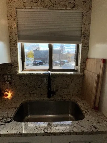 a kitchen with a sink and cabinets