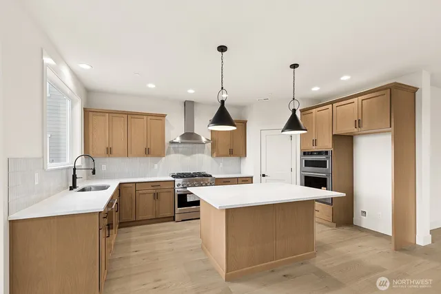 a kitchen with a sink stove and refrigerator