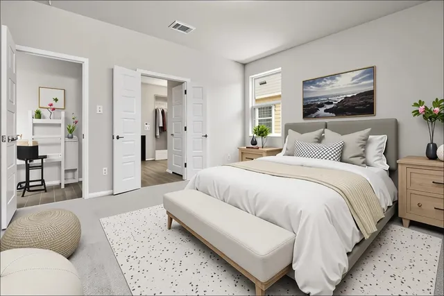 a bedroom with a bed couch and a window