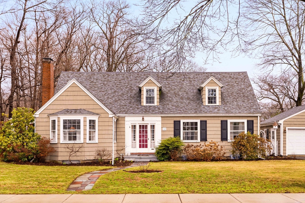 a front view of a house with a yard