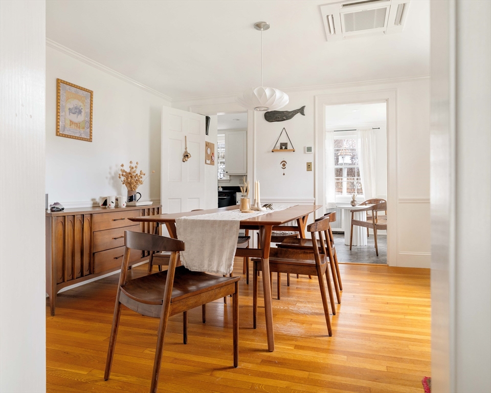 162 Colon Street Beverly, MA 01915 - Photo 12 of 35 a view of a dining room with furniture and wooden floor