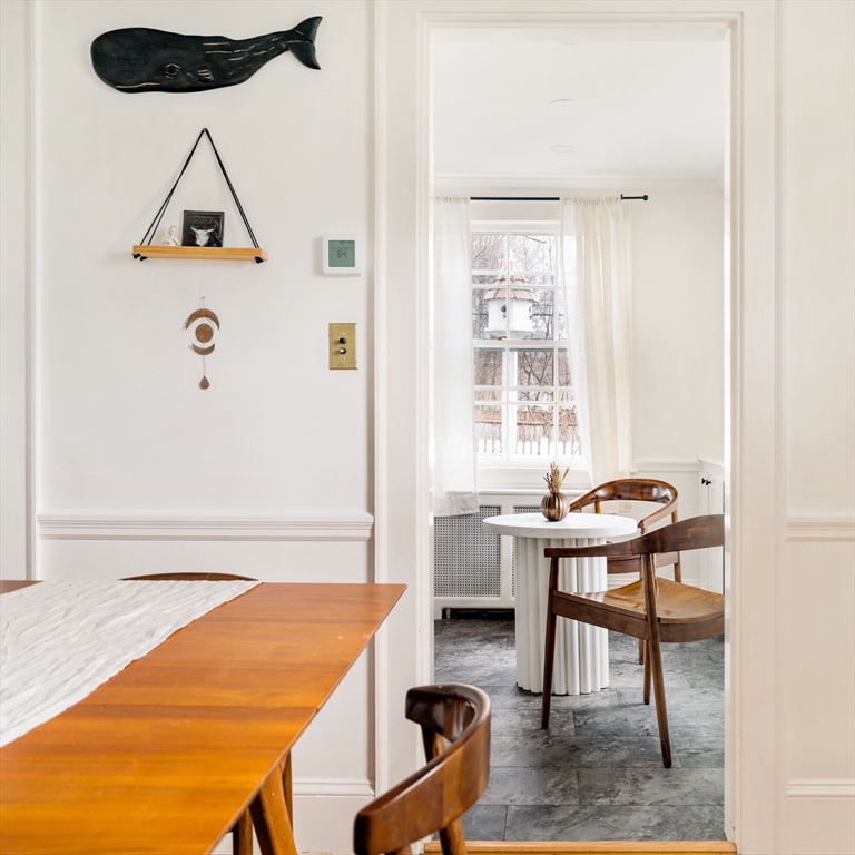 162 Colon Street Beverly, MA 01915 - Photo 13 of 35 a room that has a table and a chair in it