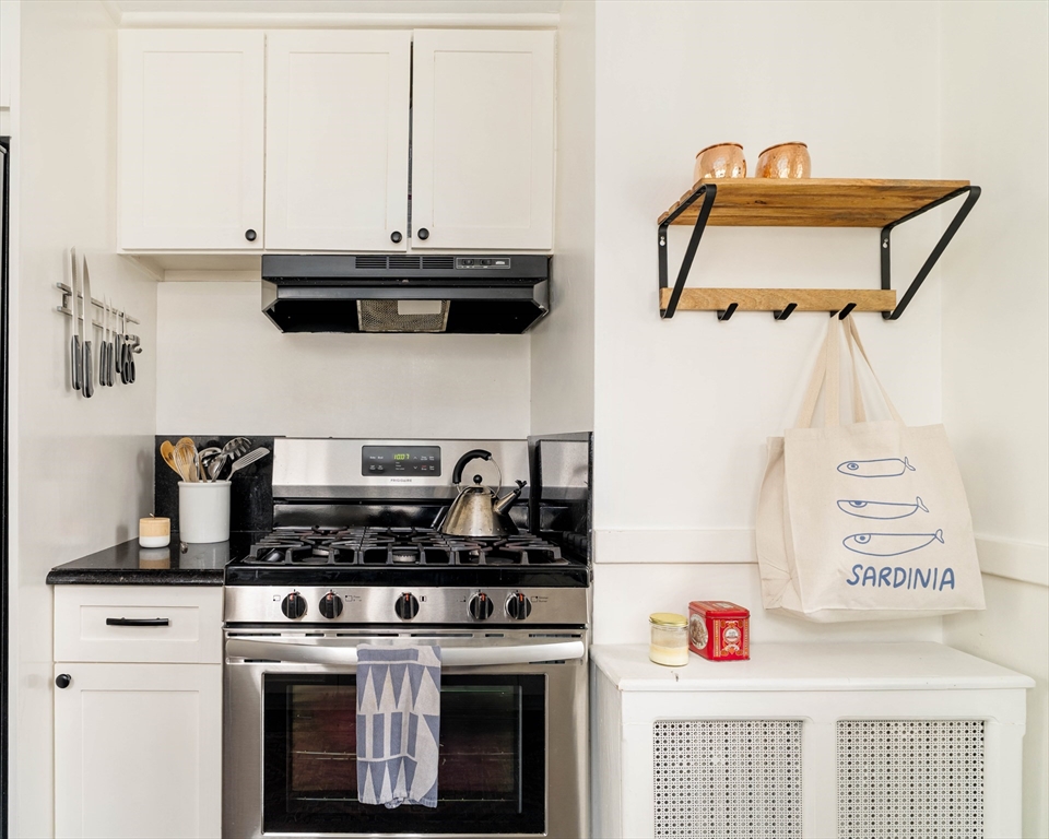 162 Colon Street Beverly, MA 01915 - Photo 16 of 35 a kitchen with a stove and a microwave