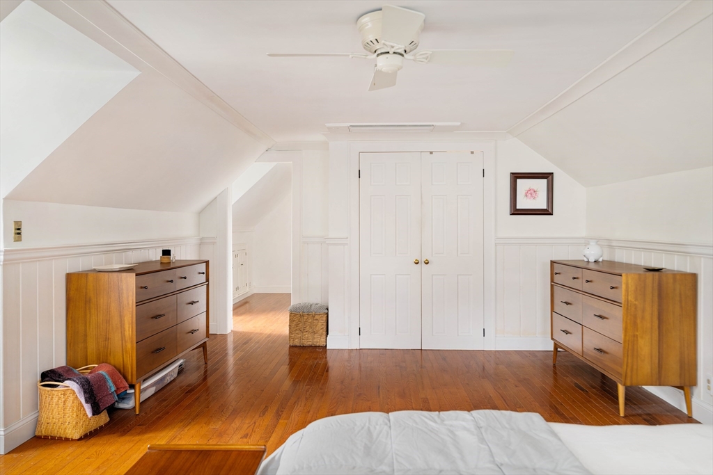 162 Colon Street Beverly, MA 01915 - Photo 27 of 35 a view of a bedroom with furniture and wooden floor