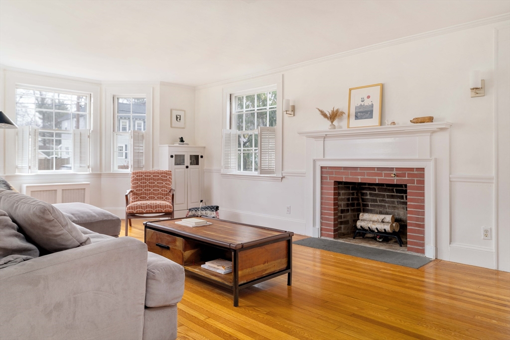 162 Colon Street Beverly, MA 01915 - Photo 3 of 35 a living room with furniture and a fireplace