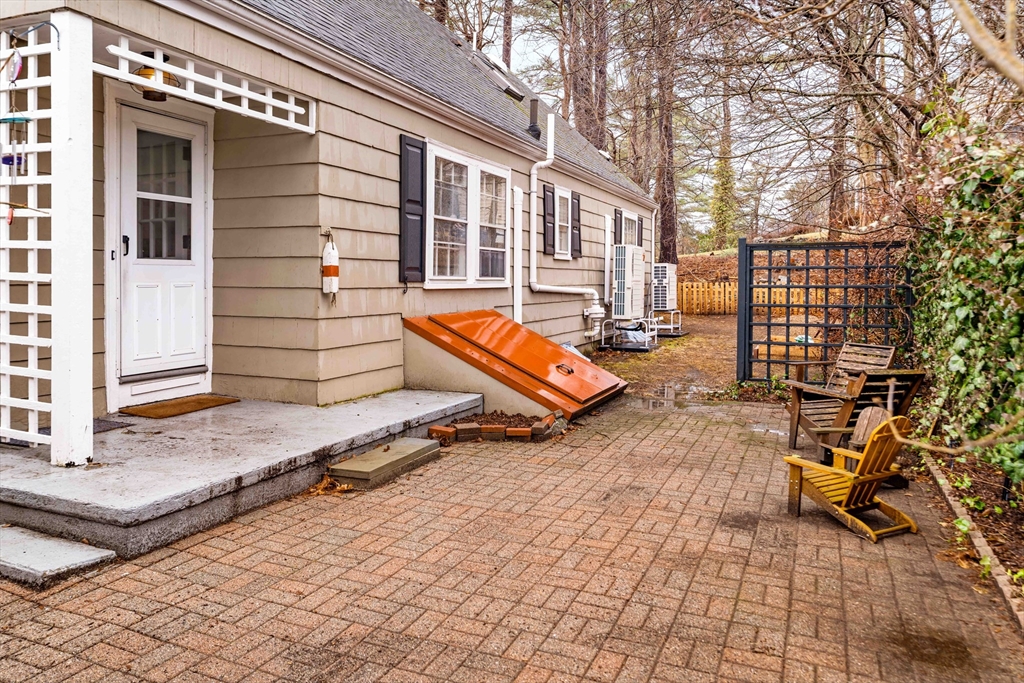 162 Colon Street Beverly, MA 01915 - Photo 31 of 35 a backyard of a house with barbeque oven table and chairs