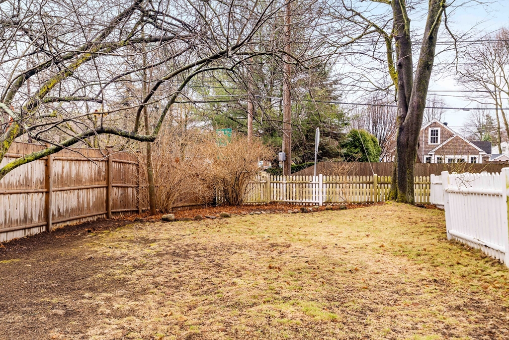 162 Colon Street Beverly, MA 01915 - Photo 33 of 35 a view of a yard covered with snow in front of house