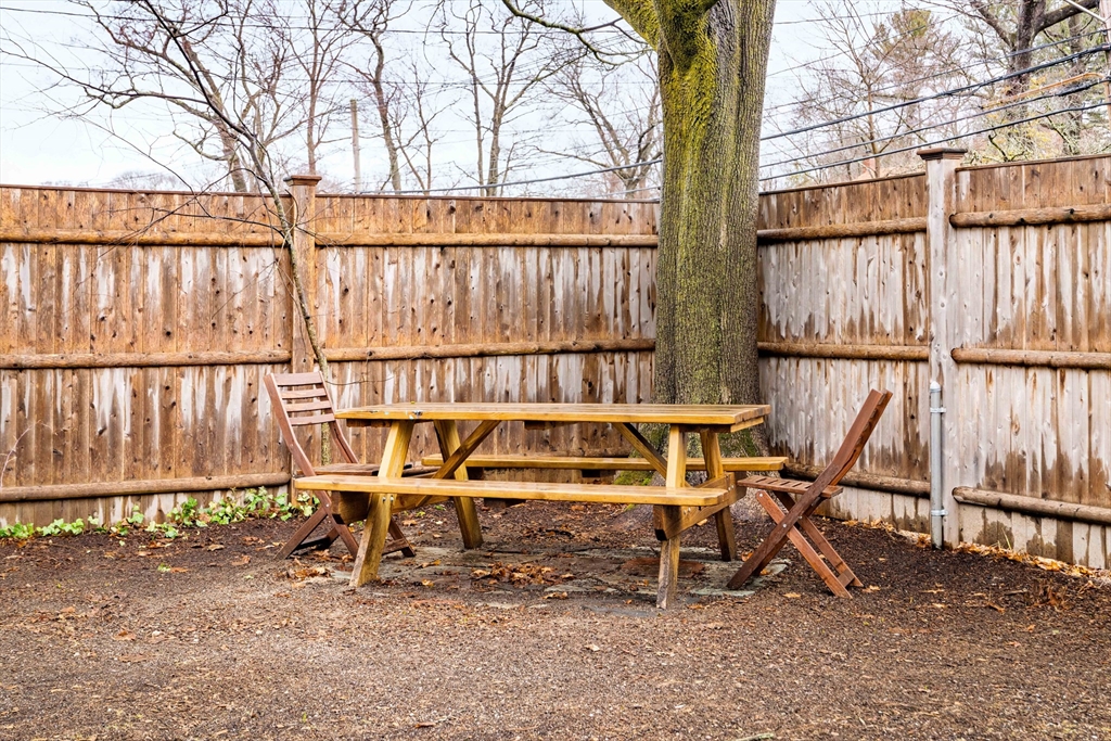 162 Colon Street Beverly, MA 01915 - Photo 34 of 35 a bench sitting in front of a building