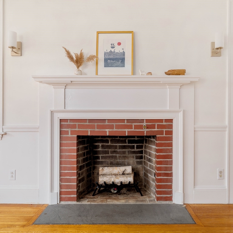 162 Colon Street Beverly, MA 01915 - Photo 4 of 35 a living room with furniture and a fireplace