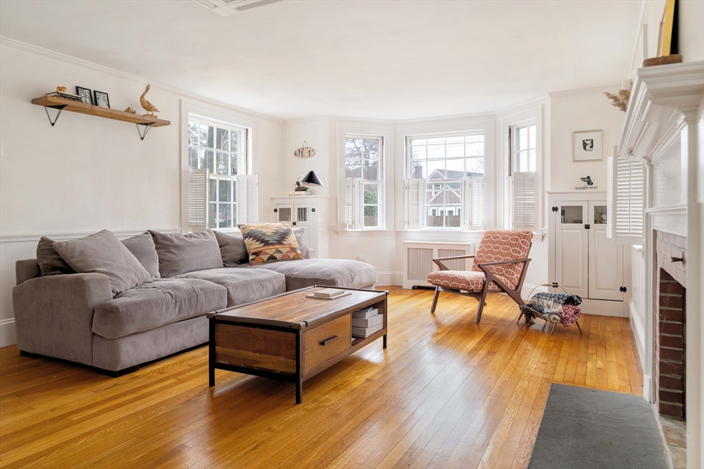162 Colon Street Beverly, MA 01915 - Photo 6 of 35 a living room with furniture and a wooden floor
