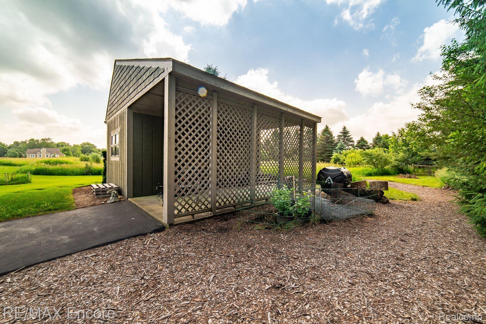 5903 Oakhill Road Clarkston, MI 48348 - Photo 60 of 72 Storage shed w/ carport & electricity (2010)