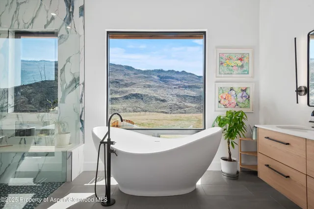 a white bath tub sitting in a bathroom