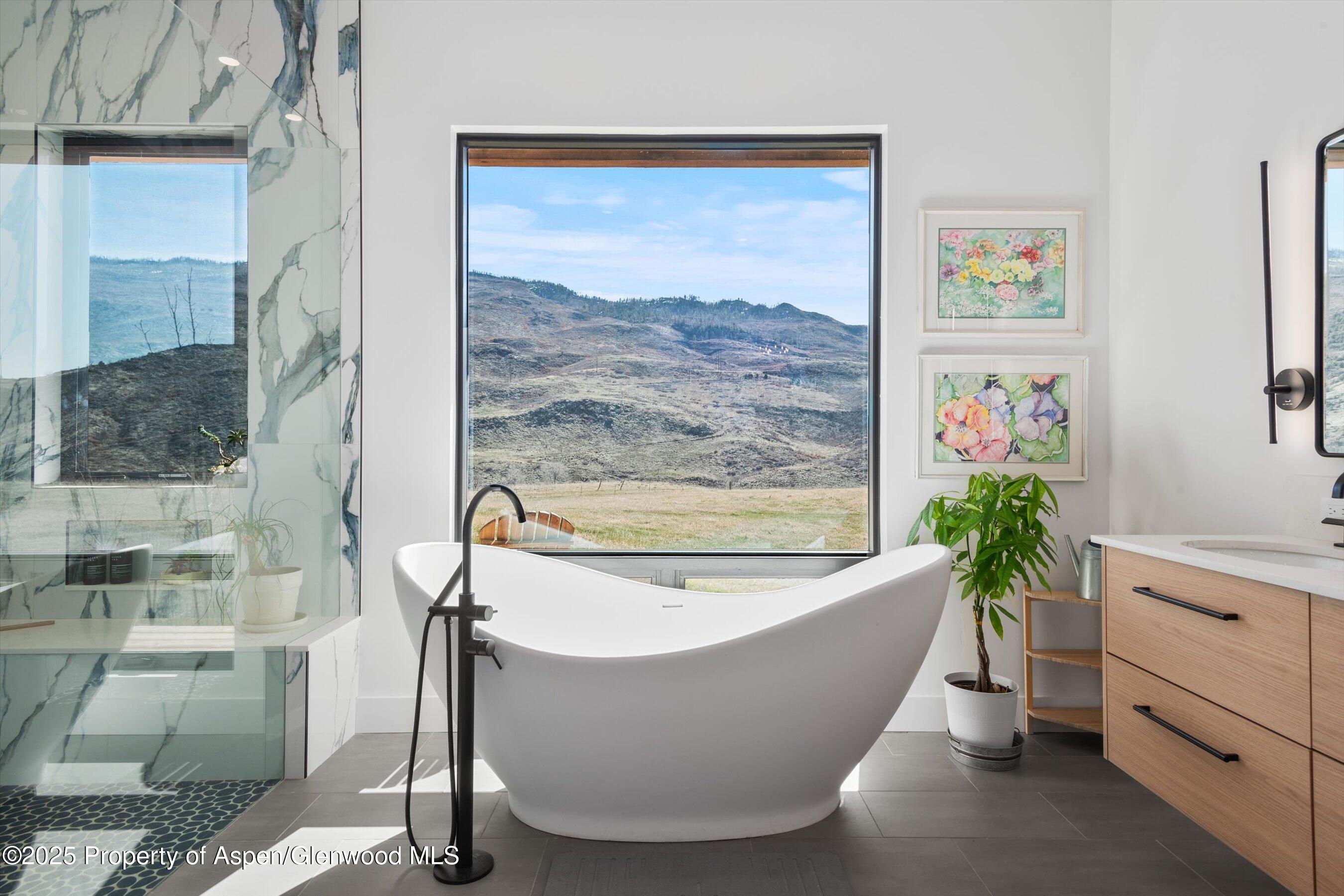 1840 Upper Cattle Creek Road Carbondale, CO 81623 - Photo 19 of 37 a white bath tub sitting in a bathroom