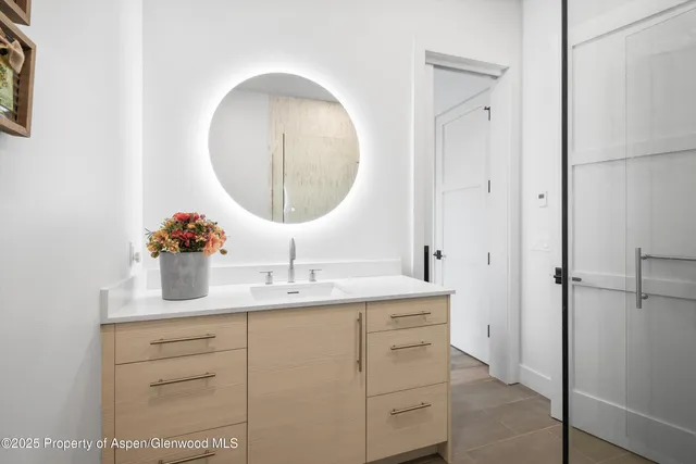 a bathroom with a sink and a mirror