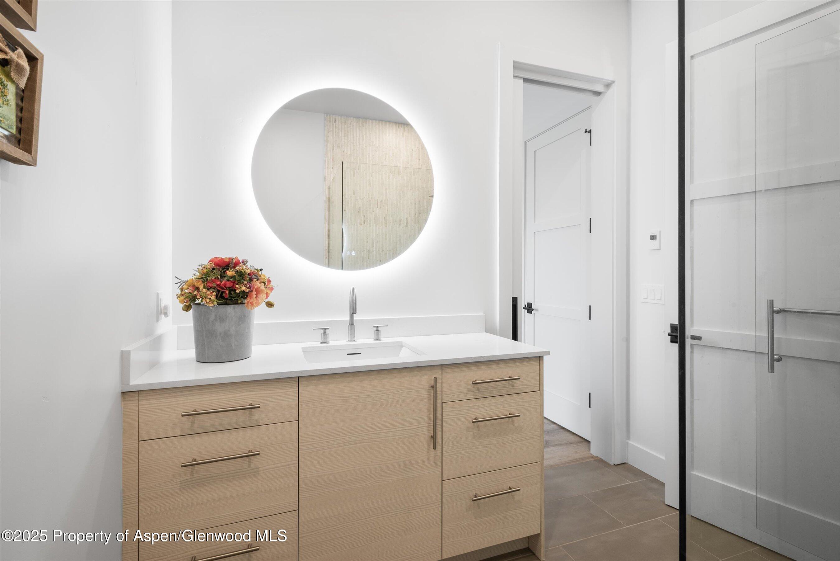 1840 Upper Cattle Creek Road Carbondale, CO 81623 - Photo 24 of 37 a bathroom with a sink and a mirror