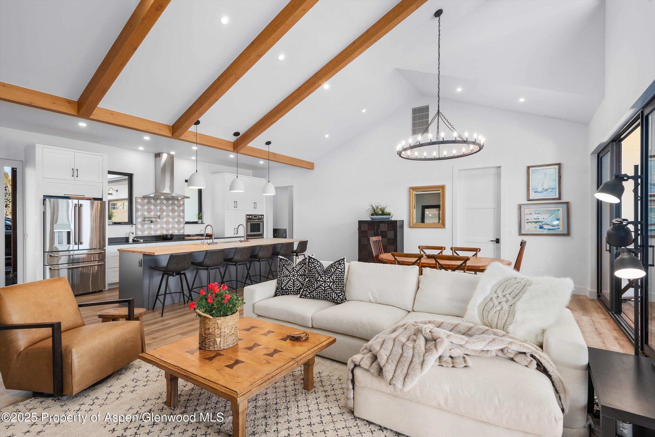 1840 Upper Cattle Creek Road Carbondale, CO 81623 - Photo 3 of 37 a living room with furniture kitchen view and a chandelier