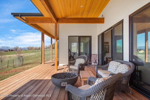 a outdoor space with patio the couches and pool table and chairs