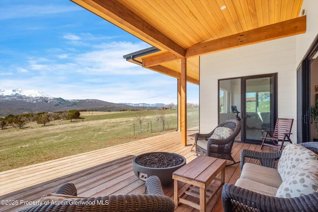 a outdoor space with patio the couches and pool chair with swimming pool view