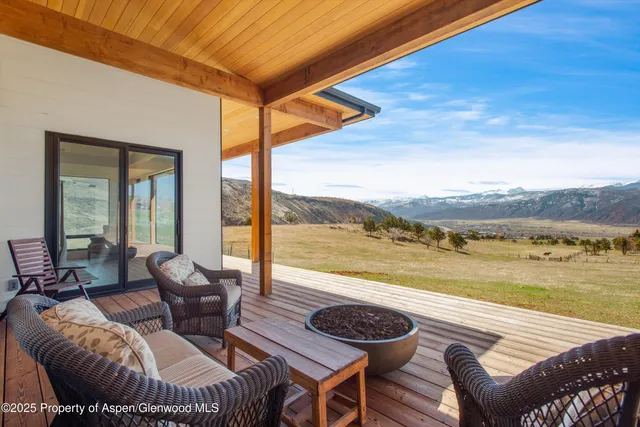 a balcony with furniture and city view
