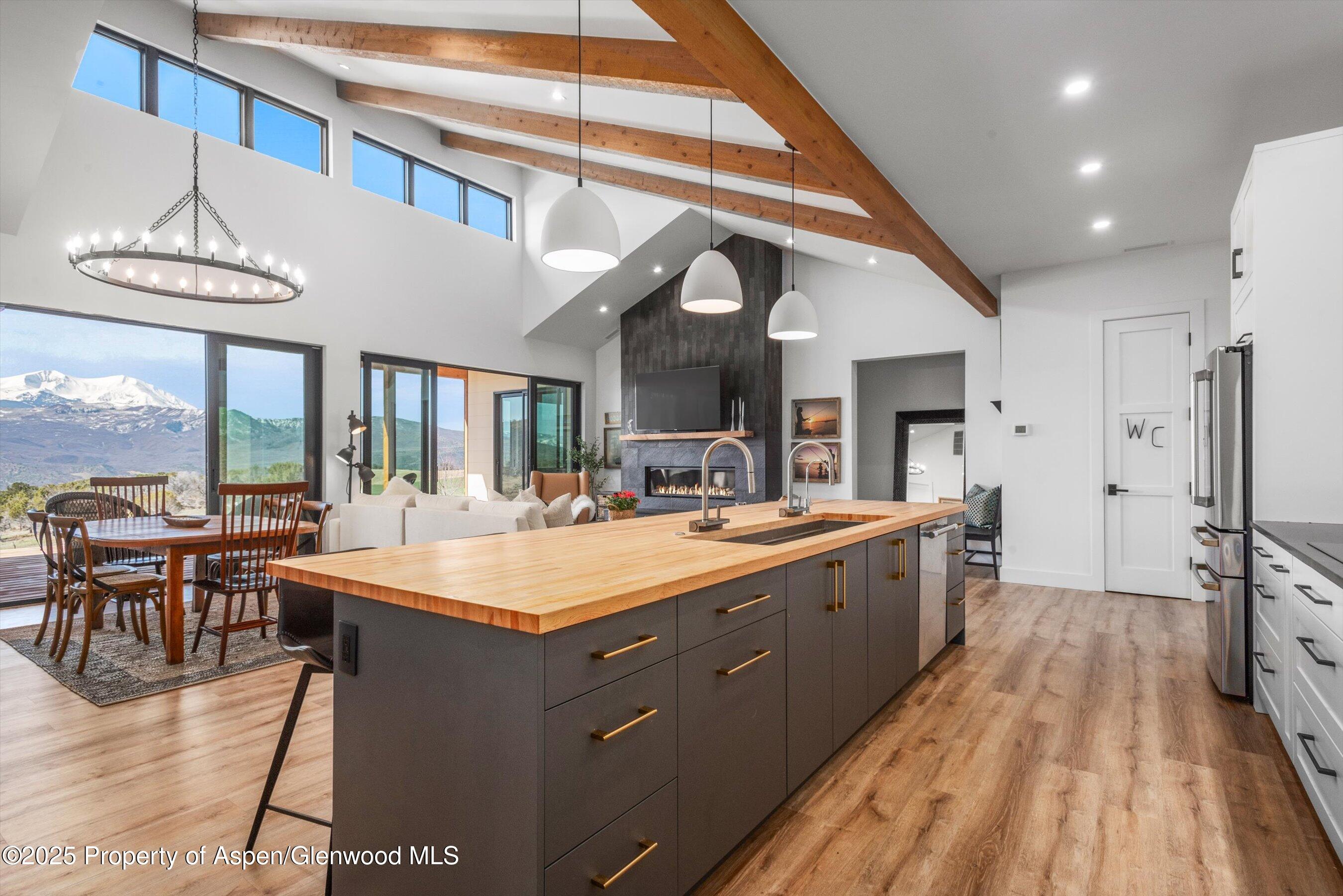 1840 Upper Cattle Creek Road Carbondale, CO 81623 - Photo 6 of 37 a large kitchen with kitchen island a large island in it