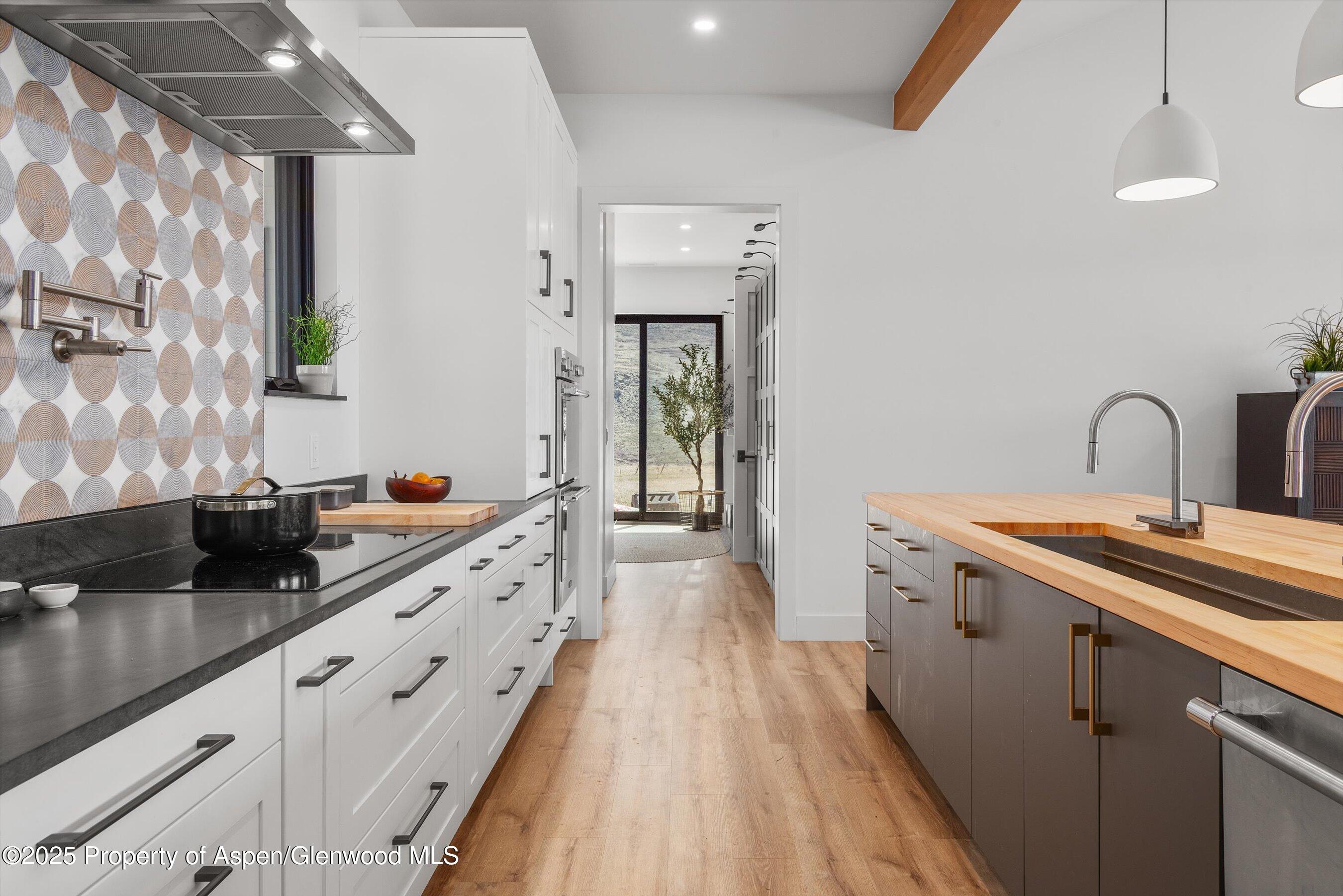 1840 Upper Cattle Creek Road Carbondale, CO 81623 - Photo 10 of 37 a kitchen with granite countertop a sink and cabinets
