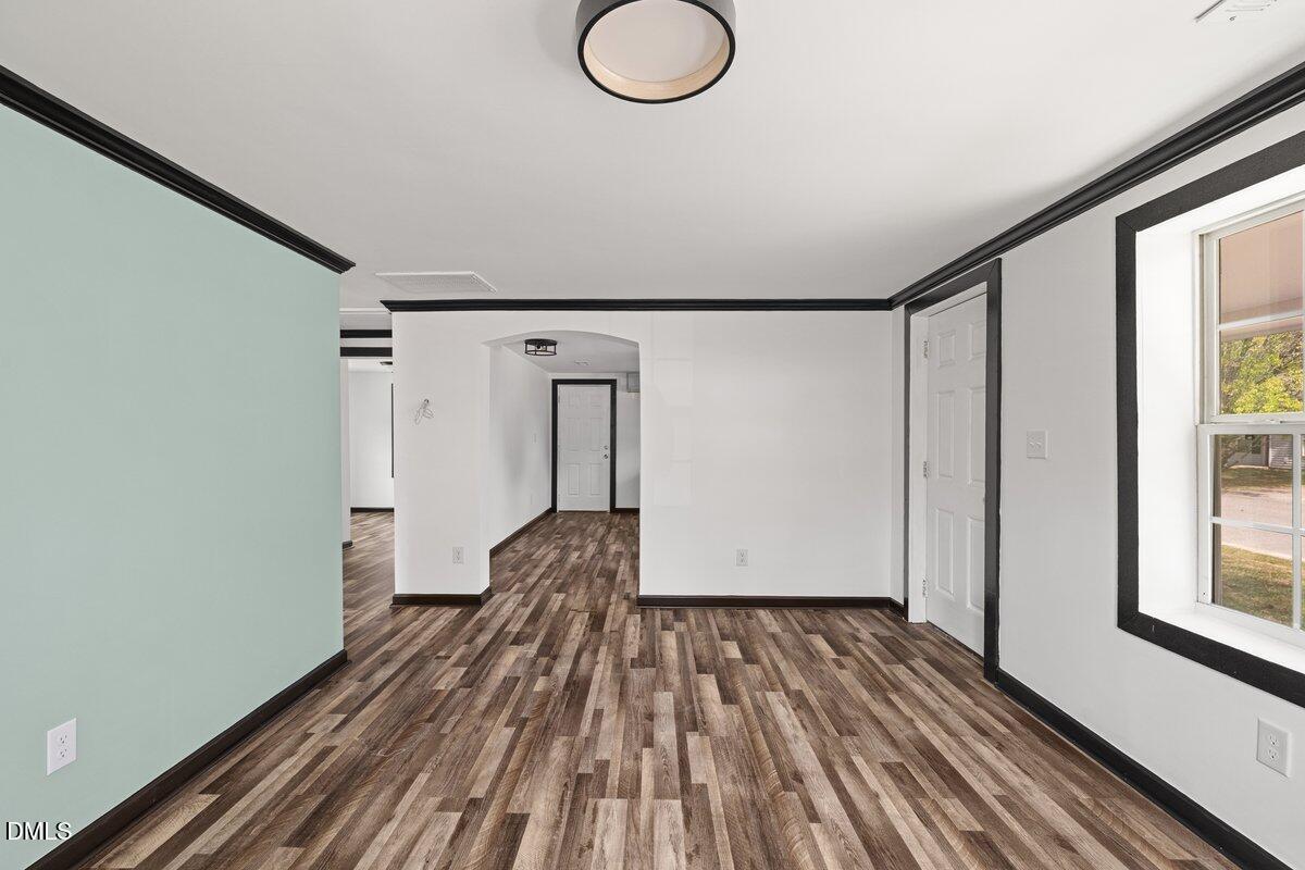601 Temple Street Selma, NC 27576 - Photo 11 of 13 a view of a room with wooden floor and glass door