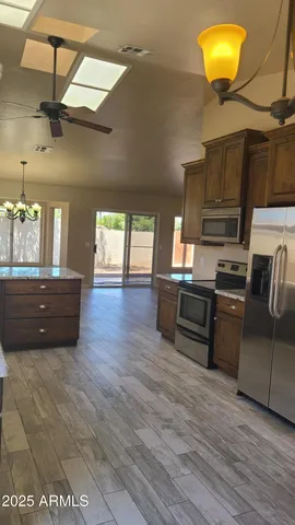 a kitchen with cabinets and stainless steel appliances