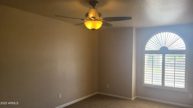 a kitchen with stainless steel appliances granite countertop a refrigerator a sink dishwasher a stove and a dining table with wooden floor