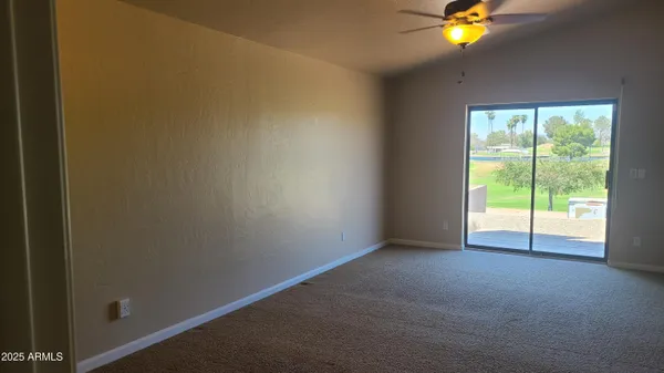 a view of entryway with a chandelier fan
