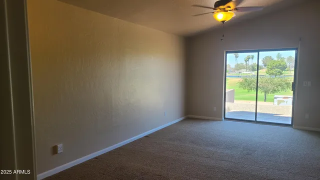 a view of entryway with a chandelier fan
