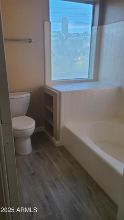 a view of a lake with a house in the background